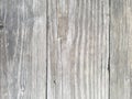 Wood texture background, tree knot, closeup of table outdoors. Vertical planks. Surface has three sections.