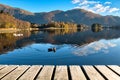 Wood Texture and Beautiful Autumn Landscape Background with Colorful Trees, Mountains, Blue Sky, Ducks Swimming in Lake Reflection Royalty Free Stock Photo