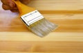 Wood texture, human hand and paintbrush Royalty Free Stock Photo