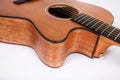 Wood texture of lower deck of six strings acoustic guitar on white background. guitar shape