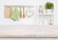 Wood texture table over blurry kitchen wall and shelf background