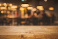 Wood texture table top counter bar with blur light gold bokeh in cafe,restaurant background.For montage product display or Royalty Free Stock Photo