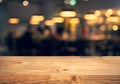 Wood texture table top counter bar with blur light gold bokeh in cafe,restaurant background.For montage product display or Royalty Free Stock Photo