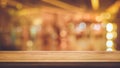 Wood texture table top counter bar with blur light gold bokeh in night cafe background Royalty Free Stock Photo