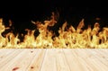 Wood top divides 1 to 2 parts on Fire flames blurred on black background. - can be used for display or montage your products