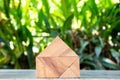 Wood toy as dream house concept with blurred green blackground Royalty Free Stock Photo