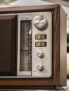 Wood vintage antique analog radio with radio dial on wooden table. Royalty Free Stock Photo