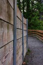 Wood wall along a path Royalty Free Stock Photo