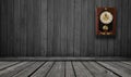 wood wall with a clock showing the time is five minutes to twelve Royalty Free Stock Photo
