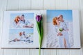 Wood wedding photo book. Happy young couple in love. Bride and groom walking of wedding day. Royalty Free Stock Photo