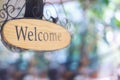 wood welcome sign hanging. selective focus