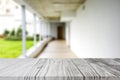 Wood white table top on blur building hall background form office building.For montage product display and design key visual Royalty Free Stock Photo