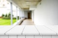 Wood white table top on blur building hall background form office building.For montage product display and design key visual Royalty Free Stock Photo