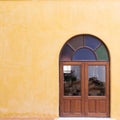 Wood window on yellow cement mortar wall Royalty Free Stock Photo