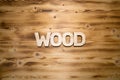 WOOD word made with building blocks on wooden board Royalty Free Stock Photo