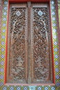 Wood work door in temple wat samien nari bangkok temple thailand Royalty Free Stock Photo