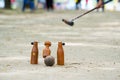 Woodball player on field with woodball gate and stick on competi