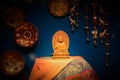 Woodcarving buddha on table in display window