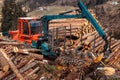 Woodcutter log truck tree harvester working in forest. Concept industry cut wood Royalty Free Stock Photo