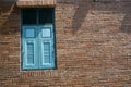 Woodden window  blue and old brick wall texture background Royalty Free Stock Photo