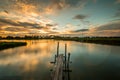 Wooded bridge in the port at sunset. Royalty Free Stock Photo