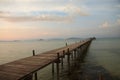 Wooded bridge stretches across the sea Royalty Free Stock Photo