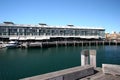 Adaptive reuse of building converted from industrial pier long building at marina with yachts, Woolloomooloo, Sydney, Australia