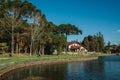 Wooded park with lake and rustic house in Gramado