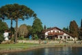 Wooded park with lake and rustic house in Gramado