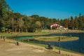 Wooded park with lake and rustic house in Gramado