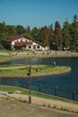 Wooded park with lake and rustic house in Gramado