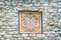 Wooded window and rock wall from bhutan Royalty Free Stock Photo