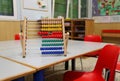 Wooden abacus in the classroom to learn decimal numeral system