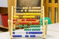 Wooden Abacus with many small beads in the classroom