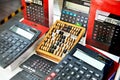 Wooden abacus and electronic calculators Royalty Free Stock Photo