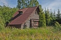 Wooden abandoned house in forest windy weather