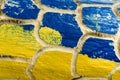 Ukrainian flag colors. Carved wood is painted in yellow and blue colors. Patriotic texture