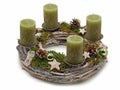 Wooden advent wreath with green candles, christmas balls moss and stars isolated on white background Royalty Free Stock Photo