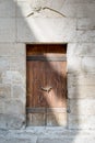 Wooden aged door and stone wall , Cairo, Egypt