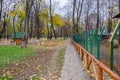 Wooden alley in a beautiful autumn landscape, Roman Park, Romania