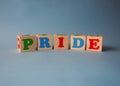 Wooden alphabet ABC toy blocks with the text: pride. Royalty Free Stock Photo