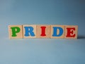 Wooden alphabet ABC toy blocks with the text: pride. Royalty Free Stock Photo