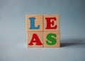 Wooden alphabet toy blocks with the counterclockwise text: sale. Isolated kids multi-colored ABC cubes on blue background