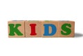 Wooden alphabet toy blocks with the text: Kids.  kids ABC cubes on white background with copy space Royalty Free Stock Photo