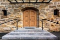 Wooden ancient door and stone wall