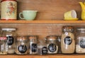 Wooden Antique Kitchen Hutch with jars of baking ingredients and retro crockery