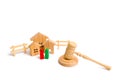 Wooden apartment house with people, keys and a judge hammer on a white background. The concept of laws and regulations for tenants Royalty Free Stock Photo