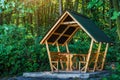 Wooden arbor in the  forest near the lake.Fishing adventures.Camping on the shore of the lake.Carp Fishing Sunset.View of a garden Royalty Free Stock Photo