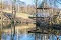 Wooden arbor by the pond in the Ukrainian village Royalty Free Stock Photo