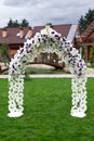 Wooden arch and chairs at wedding ceremony Royalty Free Stock Photo